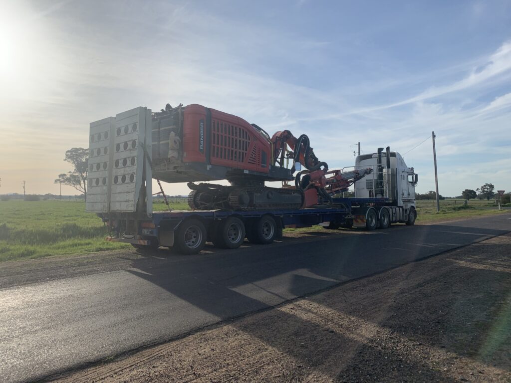 Heavy transport truck with machinery on board